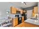 Well-maintained kitchen with light wood cabinets and updated appliances at 8481 W Union Ave # 13203, Denver, CO 80123