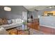 Open-concept living area with hardwood floors, vaulted ceilings, and contemporary decor at 8481 W Union Ave # 13203, Denver, CO 80123