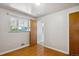 Bright bedroom with hardwood floors, natural light, and a neutral color palette at 2546 S Stuart St, Denver, CO 80219