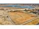 Aerial view showcasing the dog park adjacent to a serene lake and residential area at 17478 E Rice Cir # D, Aurora, CO 80015
