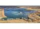 Aerial view of a partially frozen lake surrounded by community homes and open space, near walking trails at 17478 E Rice Cir # D, Aurora, CO 80015