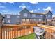 Three-story home with backyard decks overlooking a fenced-in yard at 17478 E Rice Cir # D, Aurora, CO 80015