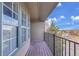 A cozy balcony with wooden deck offers a peaceful outdoor space, perfect for relaxation and enjoying the view at 17478 E Rice Cir # D, Aurora, CO 80015