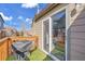 Cozy balcony with a grill, faux grass and a view of neighboring homes at 17478 E Rice Cir # D, Aurora, CO 80015