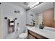 Bathroom with modern vanity, decorative mirrors and rustic towel rack at 17478 E Rice Cir # D, Aurora, CO 80015