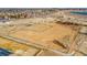 Expansive fenced dog park with open space for pets to roam, located near neighborhood at 17478 E Rice Cir # D, Aurora, CO 80015