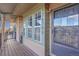 Inviting front porch entrance with stylish green siding and well-maintained wood flooring at 17478 E Rice Cir # D, Aurora, CO 80015