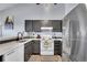 Modern kitchen with stainless steel appliances and stylish cabinetry at 17478 E Rice Cir # D, Aurora, CO 80015