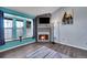 Living room featuring a fireplace, plenty of natural light, and stylish accents at 17478 E Rice Cir # D, Aurora, CO 80015