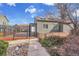 Pool entrance with metal gate, pathway, and greenery, inviting for summertime enjoyment at 17478 E Rice Cir # D, Aurora, CO 80015