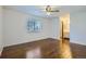 Bright bedroom with hardwood flooring, a ceiling fan, and a view of the backyard at 9088 W 88Th Cir, Westminster, CO 80021