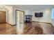 Bright living room with hardwood floors, a stone fireplace, and French doors that add a touch of elegance at 9088 W 88Th Cir, Westminster, CO 80021