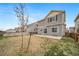 Fenced backyard with a concrete patio and space for gardening, offering privacy and outdoor living at 18039 E 108Th Pl, Commerce City, CO 80022