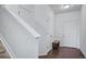 Inviting entryway featuring pristine white walls, hardwood floors, and a staircase leading to the upper level at 18039 E 108Th Pl, Commerce City, CO 80022