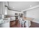 Modern kitchen featuring stainless steel appliances, granite countertops, and a center island with bar stool seating at 18039 E 108Th Pl, Commerce City, CO 80022