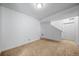 A cozy living room features neutral carpet and light-colored walls, offering a blank canvas for personalization at 18039 E 108Th Pl, Commerce City, CO 80022