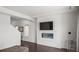 Stylish living room featuring a modern electric fireplace with stone surround and open floorplan at 18039 E 108Th Pl, Commerce City, CO 80022