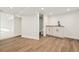 Finished basement with kitchenette and wood-look flooring at 300 Inca St, Denver, CO 80223