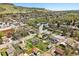 Aerial view of charming neighborhood property with mountain views, highlighted by a yellow property outline at 1914 Washington Ave, Golden, CO 80401
