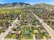 Aerial view showcasing the property location in a verdant setting with city views, outlined in yellow at 1914 Washington Ave, Golden, CO 80401