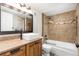Well-lit bathroom featuring granite counters, vessel sink and updated tile shower and tub at 8666 Decatur St # 254, Westminster, CO 80031