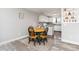 Cozy dining area adjacent to the kitchen with wood table and built-in shelving unit at 8666 Decatur St # 254, Westminster, CO 80031