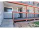 Front porch with steps leading to the front door of the unit at 8666 Decatur St # 254, Westminster, CO 80031