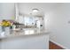 Bright kitchen featuring white cabinets, granite countertops, tile backsplash and stainless steel appliances at 8666 Decatur St # 254, Westminster, CO 80031