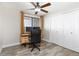 Office featuring a desk, chair, window, and double door closet at 8666 Decatur St # 254, Westminster, CO 80031