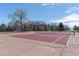 Community tennis courts for active living with adjacent playground equipment at 8666 Decatur St # 254, Westminster, CO 80031