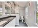 Modern bathroom with dual sinks, sleek fixtures, and stylish tiling at 825 S Quitman St, Denver, CO 80219
