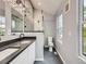 Modern bathroom with dual sinks, new fixtures, and patterned tile accents at 825 S Quitman St, Denver, CO 80219