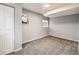 Cozy bedroom with soft carpet, white closet door, and two bright windows at 825 S Quitman St, Denver, CO 80219