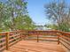 A wooden deck overlooks the fenced backyard, offering a private outdoor space at 825 S Quitman St, Denver, CO 80219
