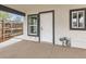 Close-up of the exterior door with storm door and modern black trim at 825 S Quitman St, Denver, CO 80219