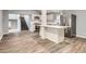 Open kitchen with stainless steel appliances and quartz countertop at 825 S Quitman St, Denver, CO 80219
