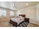 Main bedroom with a double bed and a nightstand at 1835 Virginia Dr, Fort Lupton, CO 80621