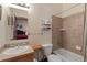 Tiled bathroom with a shower-tub combo, and vanity with a sink and wood accents at 493 Cr 672, Breckenridge, CO 80424