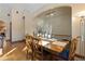 Inviting dining area featuring wood floors, natural light, and elegant decor with seating for six at 493 Cr 672, Breckenridge, CO 80424