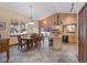 Open-concept kitchen and dining area with hardwood floors, natural light, and seating for eight at 493 Cr 672, Breckenridge, CO 80424