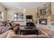 Cozy living room with a stone fireplace, plush sofas, with an open layout perfect for relaxation at 493 Cr 672, Breckenridge, CO 80424