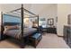 Spacious main bedroom featuring a four-poster bed, work space, and ample natural light at 493 Cr 672, Breckenridge, CO 80424