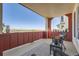 A charming balcony with wicker seating offers great views at 938 Hearteye Trl, Lafayette, CO 80026