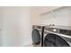 The laundry room includes a modern washer and dryer at 938 Hearteye Trl, Lafayette, CO 80026