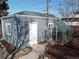 Detached garage with adjacent greenhouse at 2480 S Bannock St, Denver, CO 80223