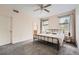 Bright bedroom featuring neutral walls, carpeted floor, and ample natural light at 23882 E Alabama Dr, Aurora, CO 80018