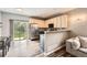 Bright kitchen with stainless steel appliances, granite countertops, and sliding glass door at 23882 E Alabama Dr, Aurora, CO 80018