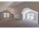 Spacious attic room with windows, offering ample natural light and potential for versatile use at 5195 Allison St, Arvada, CO 80002