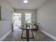 Bright entryway with a decorative table, stylish rug, and neutral color palette, creating a welcoming first impression at 5195 Allison St, Arvada, CO 80002