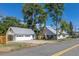 Charming home with a detached two car garage and well-maintained lawn, and mature shade trees at 5195 Allison St, Arvada, CO 80002